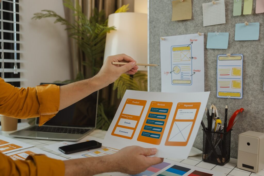 A web developer, as a User Experience and User Interface Officer, is designing beautiful and easy-to