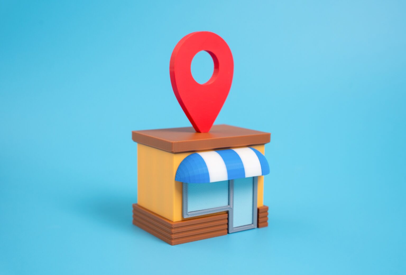 Shop with geolocation symbol on roof. Location pin button. Business location marketing
